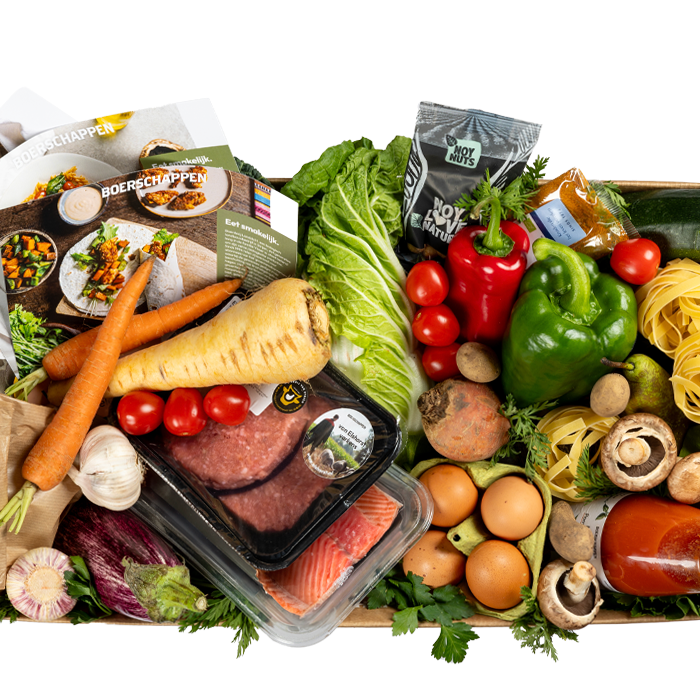 schaal met diverse soorten groenen, waaronder wortels, knoflook en paprika